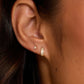 Single 18k gold plated wilder shimmer huggie earring from the jewelry brand Gorjana.