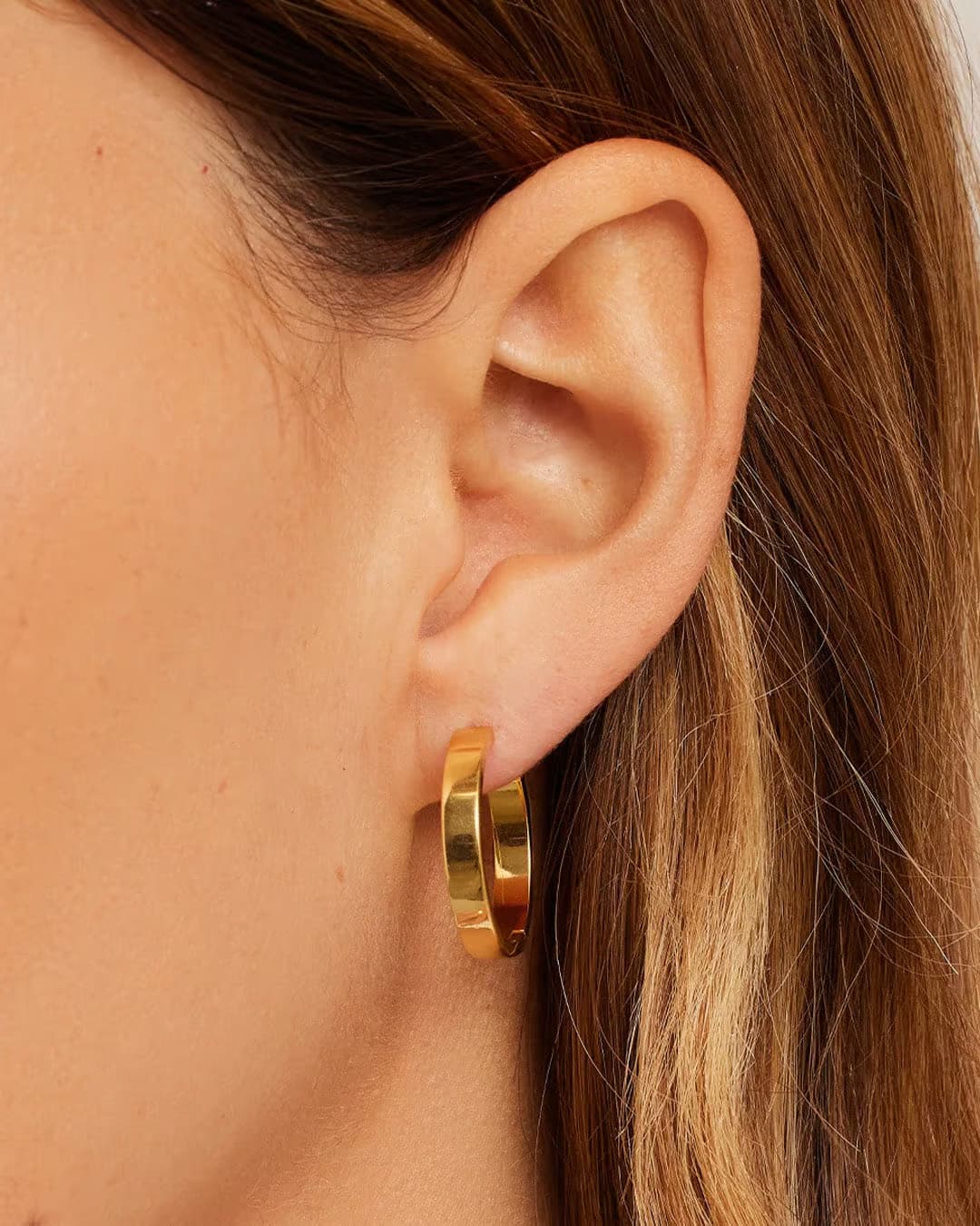 18k gold Rose Hoop Earrings from the jewelry brand Gorjana.