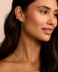 18k Gold Single Shimmer Charm Huggie Earring from the brand Gorjana.