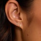 18k Gold Single Shimmer Charm Huggie Earring from the brand Gorjana.