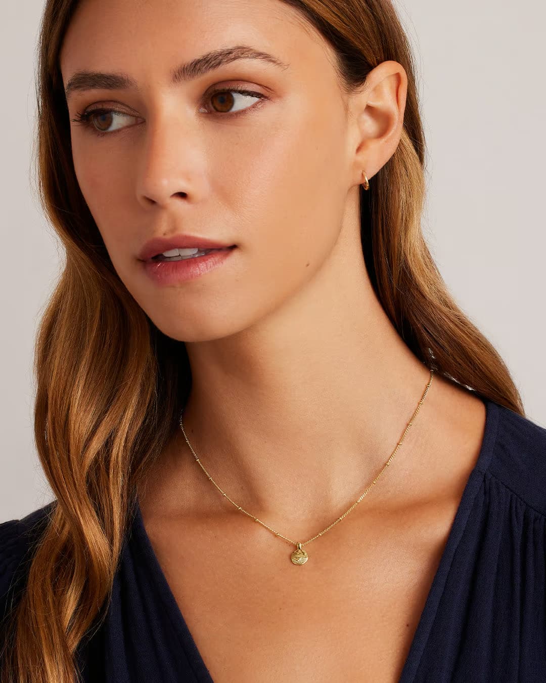 18k gold charm necklace from the jewelry brand Gorjana.