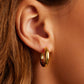 18k gold lou hoop earrings from he brand Gorjana.