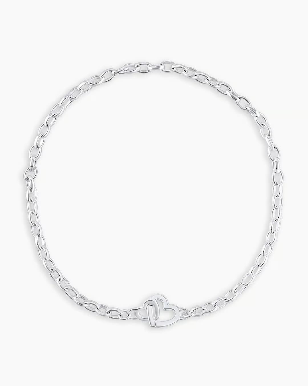 Silver chain bracelet with a mini heart closure from the brand of Gorjana. The gold is Silver plated.