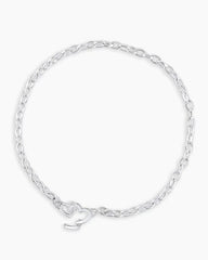 Silver chain bracelet with a mini heart closure from the brand of Gorjana. The gold is Silver plated.