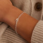 Silver chain bracelet with a mini heart closure from the brand of Gorjana. The gold is Silver plated.