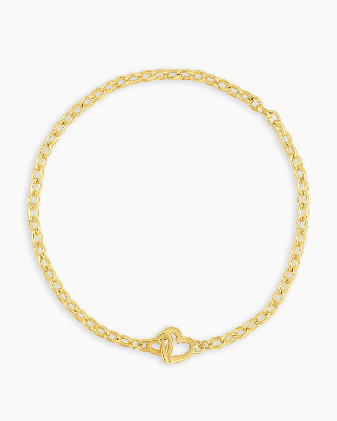 Gold chain bracelet with a mini heart closure from the brand of Gorjana. The gold is 18k gold plated.