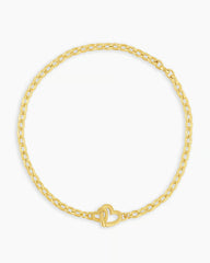 Gold chain bracelet with a mini heart closure from the brand of Gorjana. The gold is 18k gold plated.