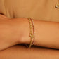 Gold chain bracelet with a mini heart closure from the brand of Gorjana. The gold is 18k gold plated.