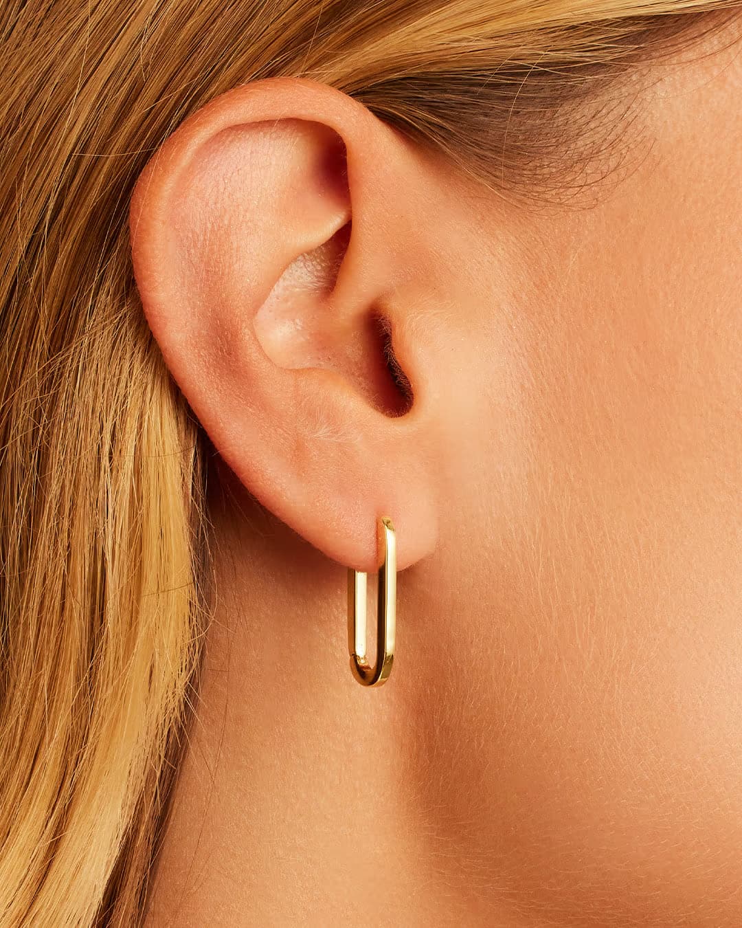 18k gold plated parker huggie earrings from the jewelry brand Gorjana.