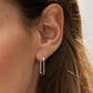 Silver plated parker huggie earrings from the jewelry brand Gorjana.