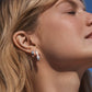 Silver plated parker huggie earrings from the jewelry brand Gorjana.