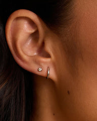 Rhodium Plated single huggie earring from the jewelry brand Gorjana.