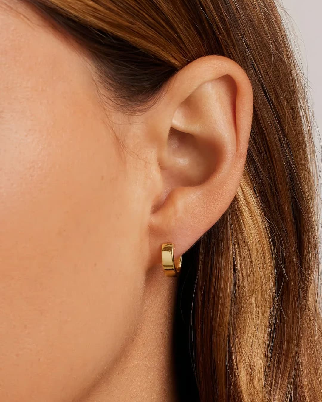 18k gold huggie earrings from the jewelry brand Gorjana.