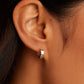 Silver plated huggie earrings from the jewelry brand Gorjana.