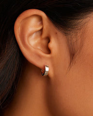 Silver plated huggie earrings from the jewelry brand Gorjana.