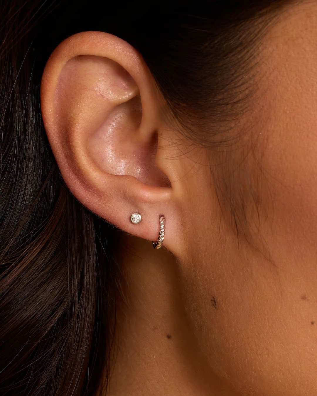 Single silver huggie earring from the jewelry brand Gorjana.