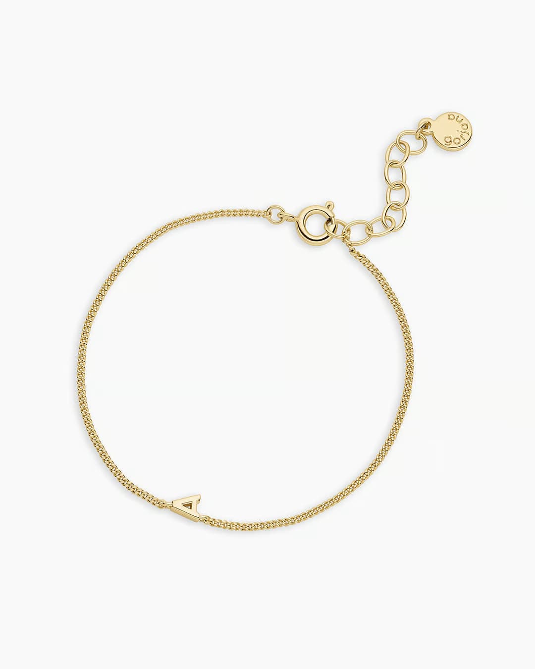 Adjustable gold bracelet with the letter A charm. The bracelet is from the jewelry brand Gorjana.