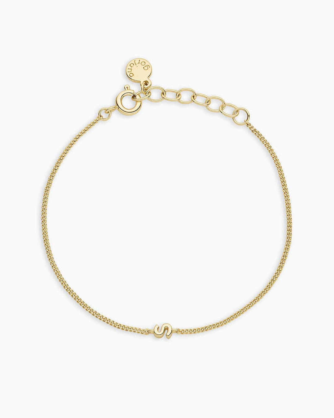 Adjustable gold bracelet with the letter S charm. The bracelet is from the jewelry brand Gorjana.