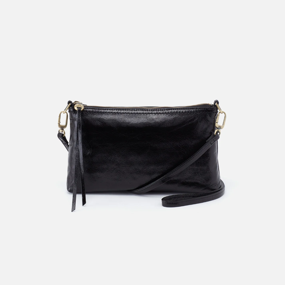 Darcy Crossbody bag designed out of polished leather in the color black. This crossbody is from the handbag brand HOBO.