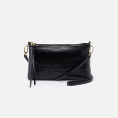 Darcy Crossbody bag designed out of polished leather in the color black. This crossbody is from the handbag brand HOBO.