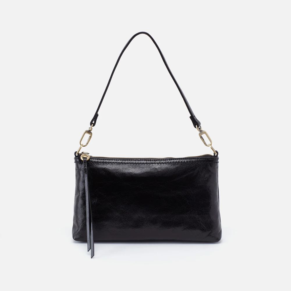 Darcy Crossbody bag designed out of polished leather in the color black. This crossbody is from the handbag brand HOBO.