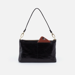 Darcy Crossbody bag designed out of polished leather in the color black. This crossbody is from the handbag brand HOBO.