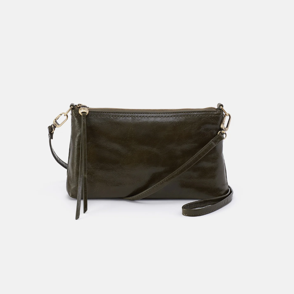 Darcy Crossbody bag designed out of polished leather in the color deep moss (green). This crossbody is from the handbag brand HOBO.