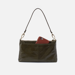 Darcy Crossbody bag designed out of polished leather in the color deep moss (green). This crossbody is from the handbag brand HOBO.