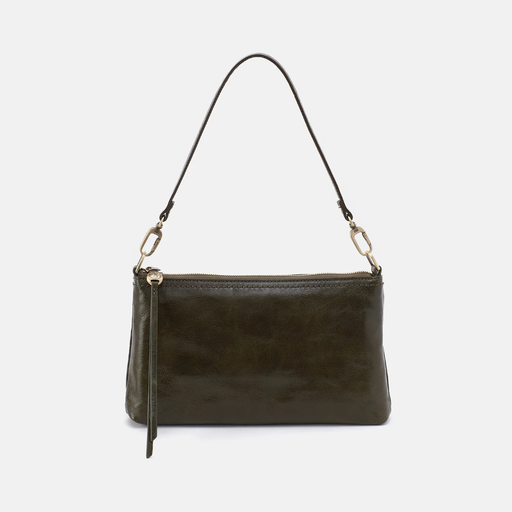 Darcy Crossbody bag designed out of polished leather in the color deep moss (green). This crossbody is from the handbag brand HOBO.