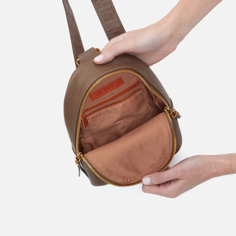 Fern Sling Bag designed from Pebbled Leather in the color Dark Elm. It comes from the bag brand HOBO.