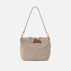 Harley Convertible Shoulder Bag in the color Taupe. The bag is designed from Pebbled leather from the brand HOBO.