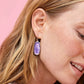 Kendra Scott Framed Elle Drop Earrings In Rhodium Lavender Opalite Illusion on a model.