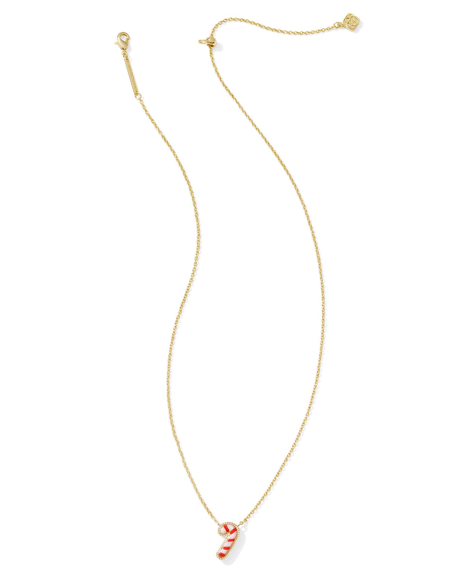 Kendra Scott gold necklace with a candy cane pendant.