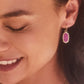 A pair of Lee Drop Earrings in Mulberry Drusy being worn by a model.
