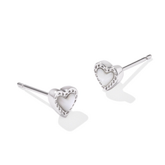 Silver heart shape stud earrings with a white charm in the middle, from the jewelry brand Kendra Scott.