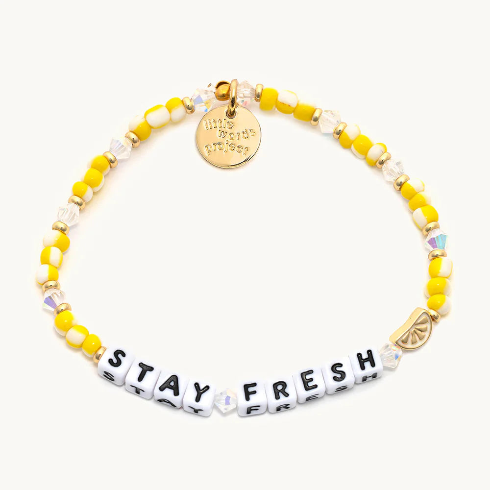 A yellow Little Words Project bracelet.