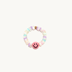A pink Smiley ring from Little Words Project - Beach Days.