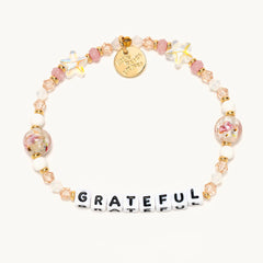 A Little Words Project® beaded bracelet that reads "Grateful."