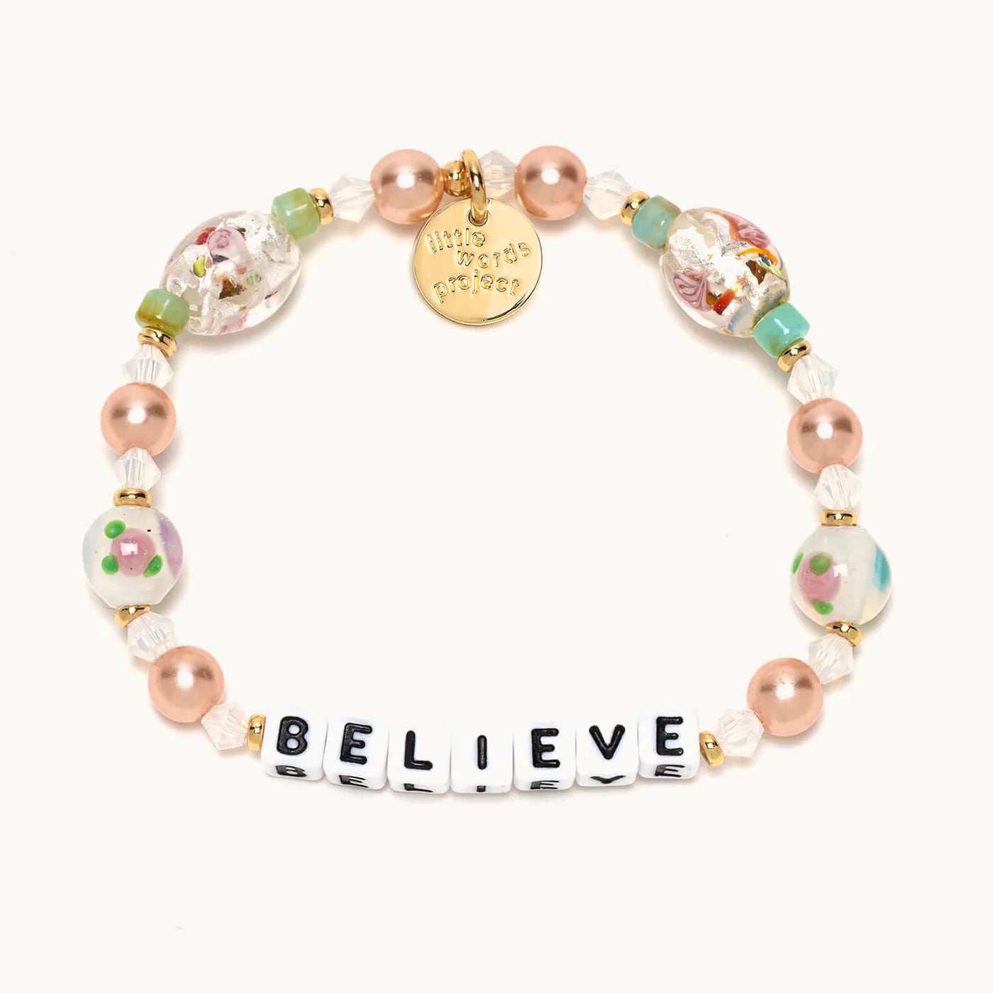 A beaded bracelet from Little Words Project® that reads "Believe".