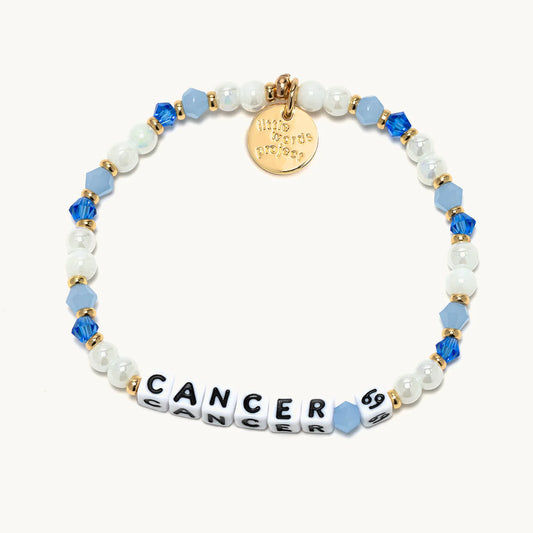 A gold and blue beaded bracelet from Little Words Project®, with the Cancer zodiac symbol. 1400