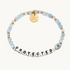 Blue bead bracelet that says, "PROTECTED" and has an evil eye symbol.