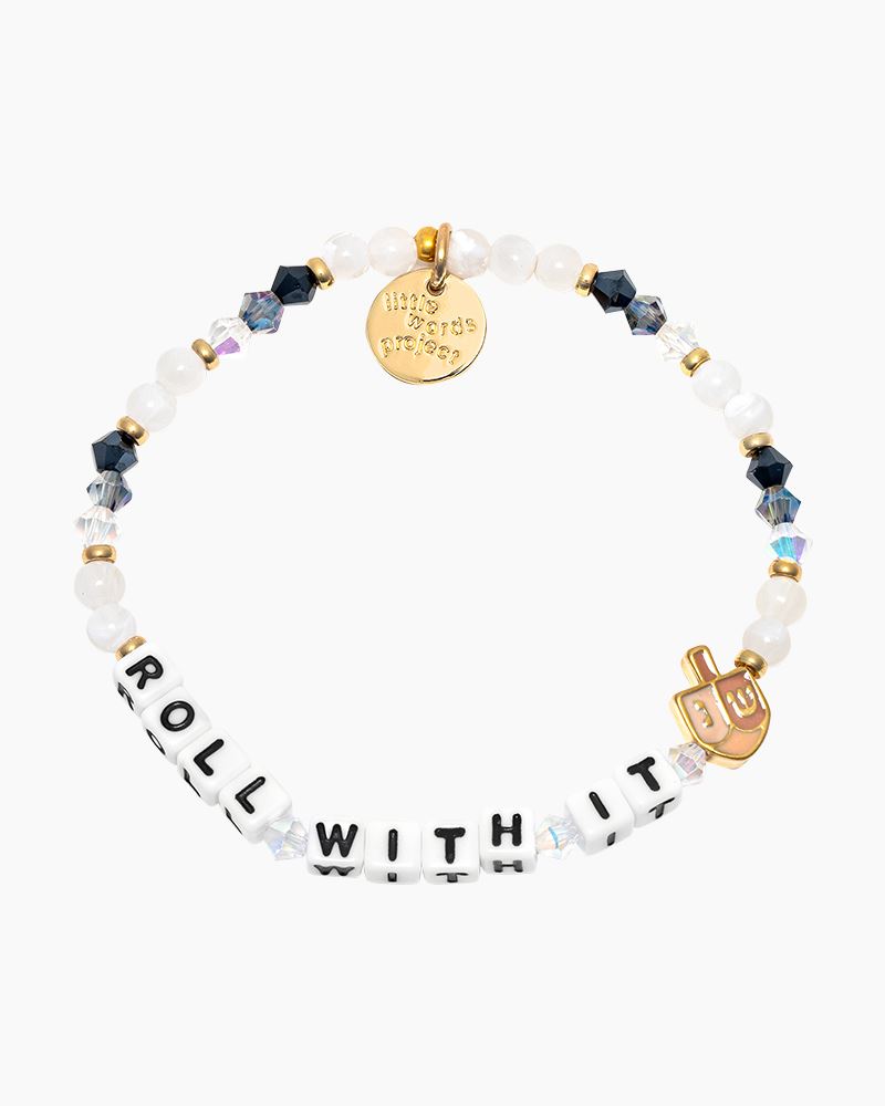 A beaded bracelet that says "ROLL WITH IT" with a dreidel charm.
