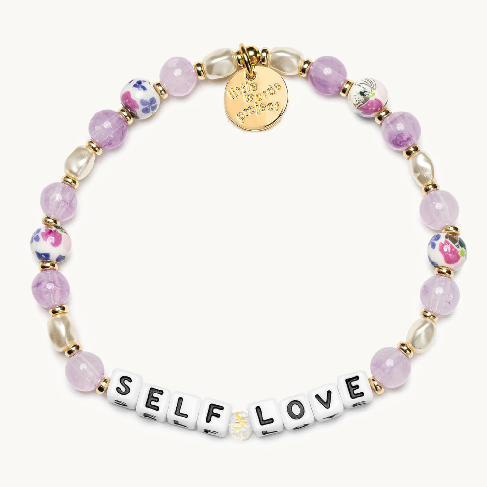 Purple beaded bracelet that reads, Self Love. Designed by Little Words Project.