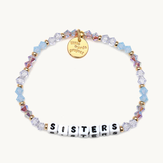 A beaded bracelet with colors blue and silver, with the phrase "Sisters". From Little Words Project®. 1400