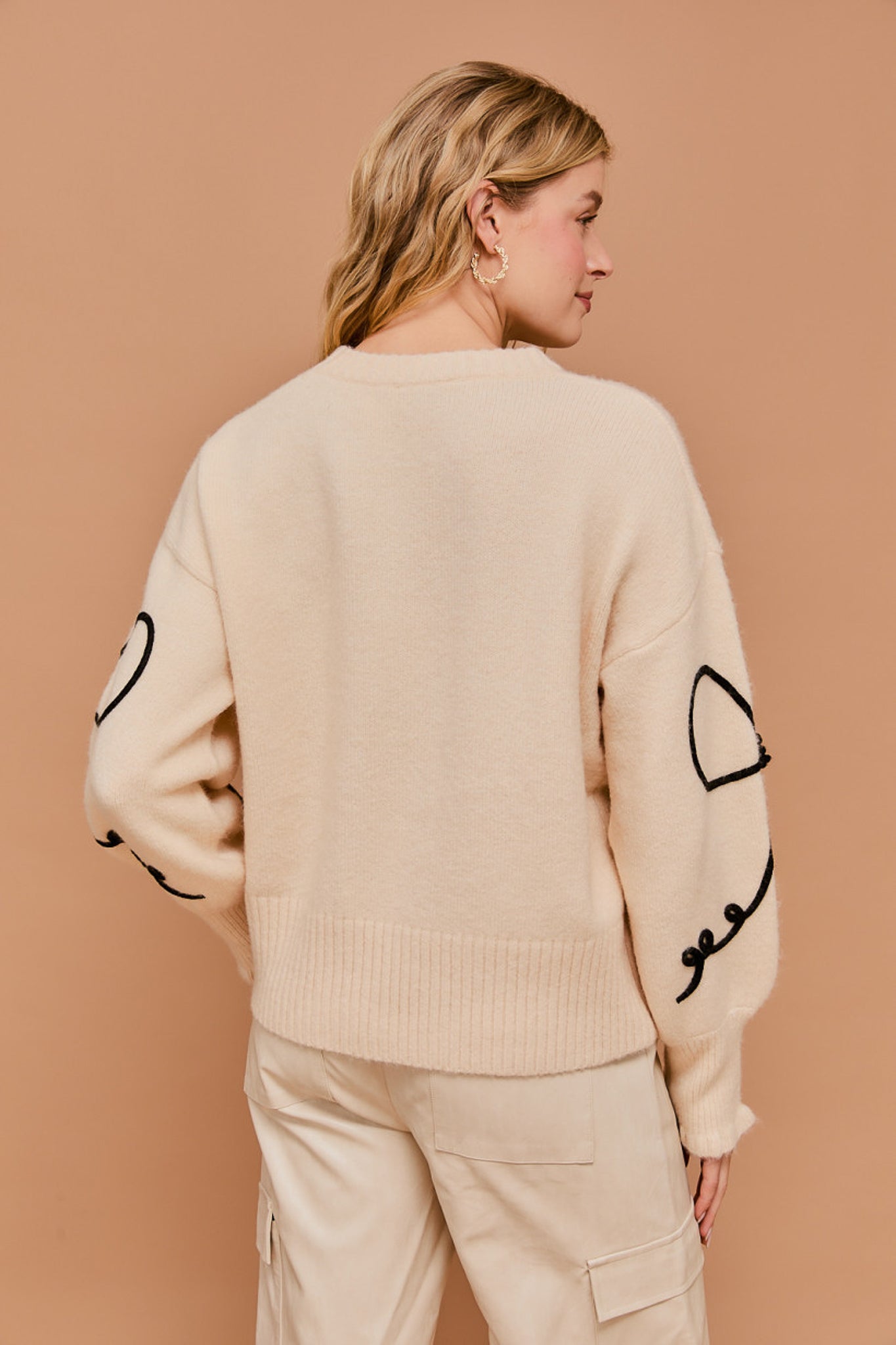 Long Sleeve Crew Neck Ribbon Sweater Top in the color cream.