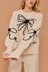 Long Sleeve Crew Neck Ribbon Sweater Top in the color cream.