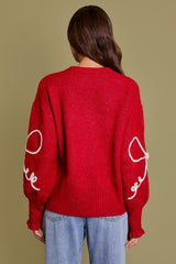 Long Sleeve Crew Neck Ribbon Sweater Top in the color red.