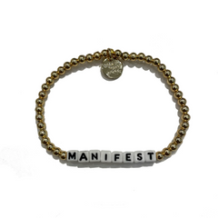 Gold filled bead bracelet from Little Words Project that reads, Manifest.