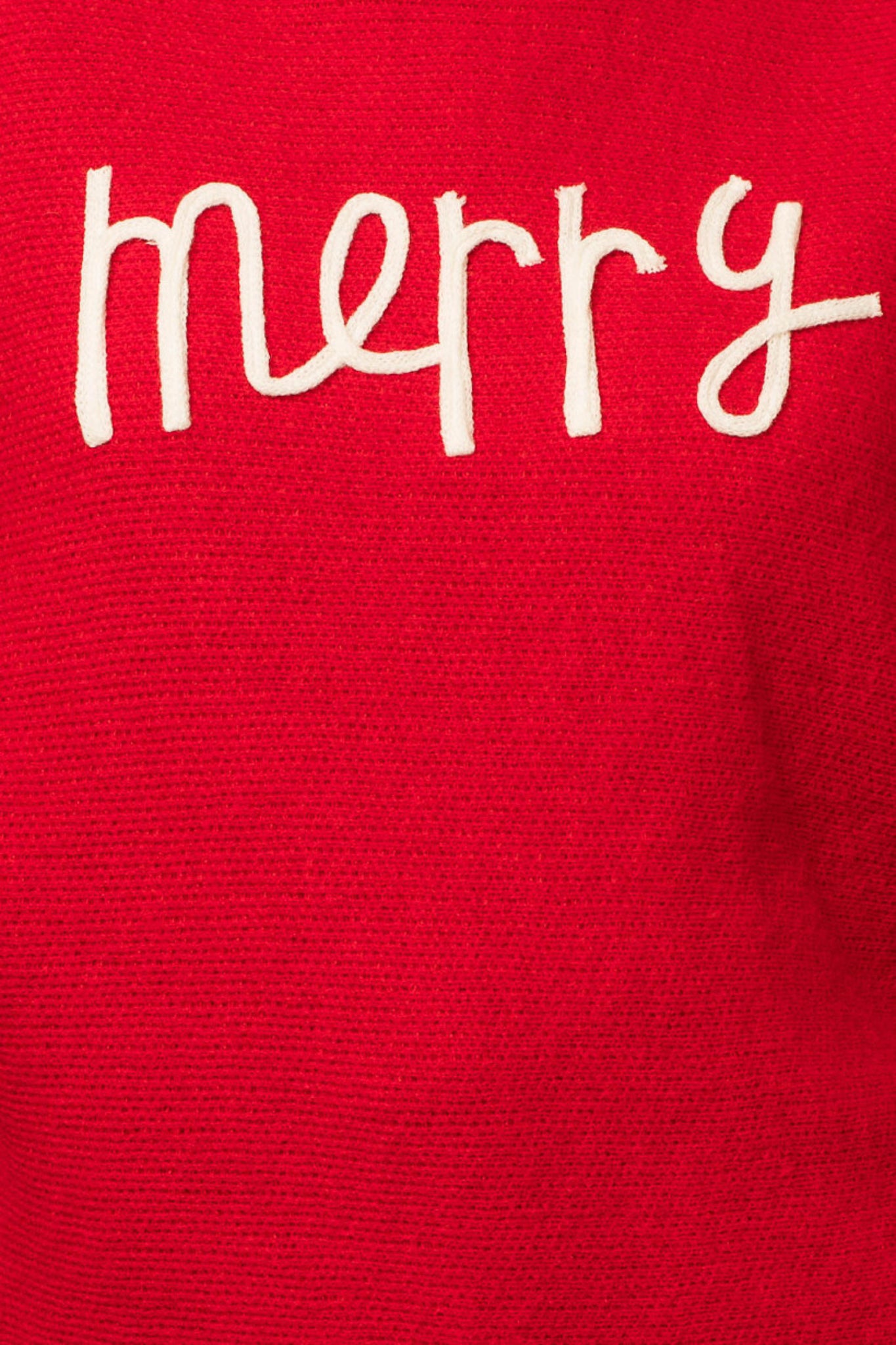 A red turtleneck sweater with the phrase "Merry" in the color white.