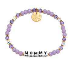 Purple bead bracelet from Little Words Project, that reads "Mommy."